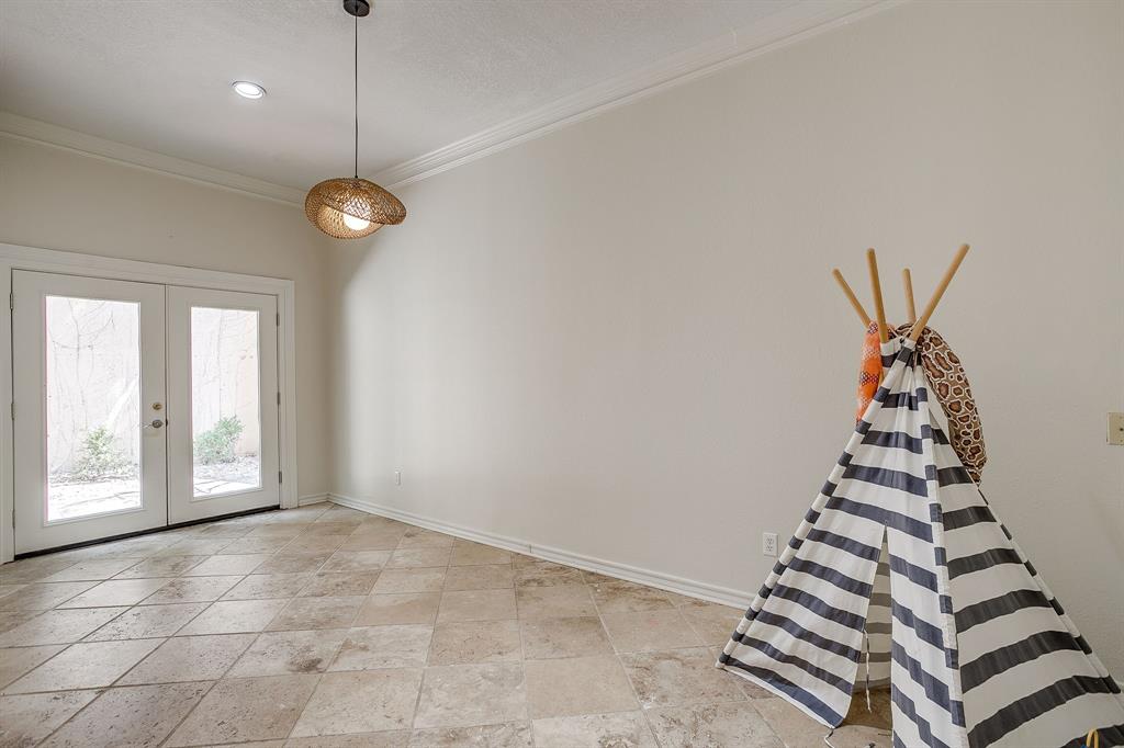 1805 Burton Hill Road Fort Worth, TX 76107 - Photo 15 of 39 an empty room with windows and white walls