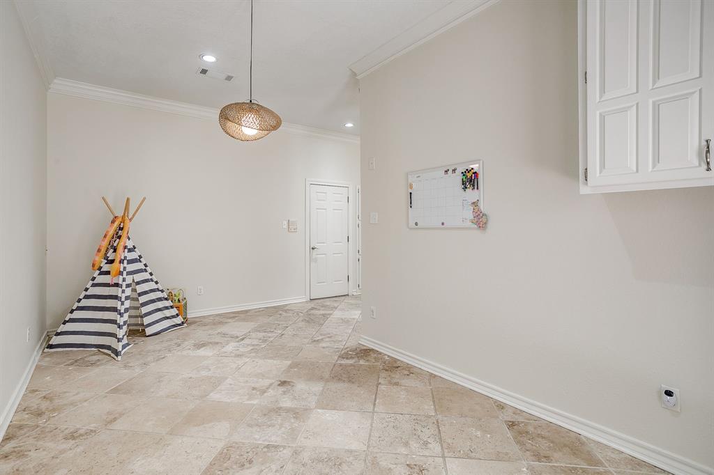 1805 Burton Hill Road Fort Worth, TX 76107 - Photo 16 of 39 an empty room with white walls and stairs