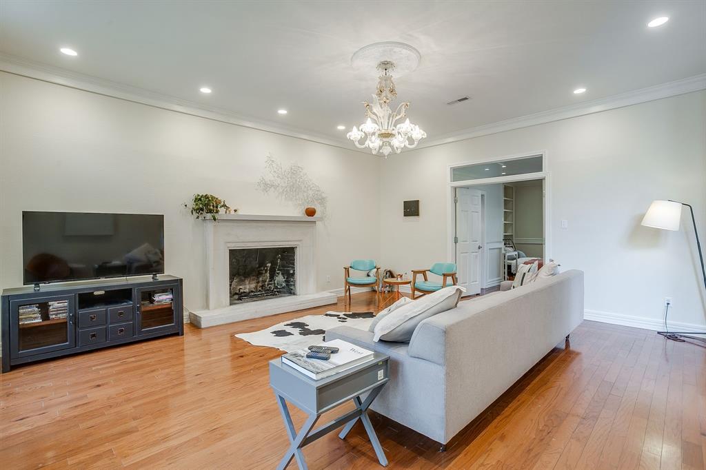 1805 Burton Hill Road Fort Worth, TX 76107 - Photo 18 of 39 a living room with furniture and a flat screen tv