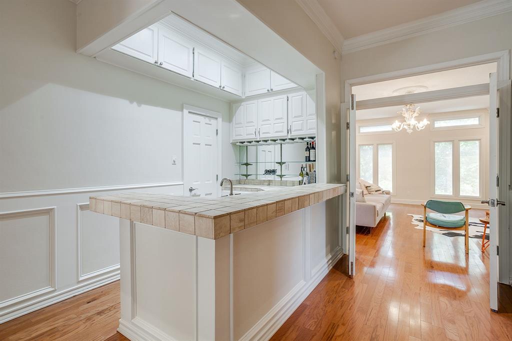 1805 Burton Hill Road Fort Worth, TX 76107 - Photo 23 of 39 a large white kitchen with a large window