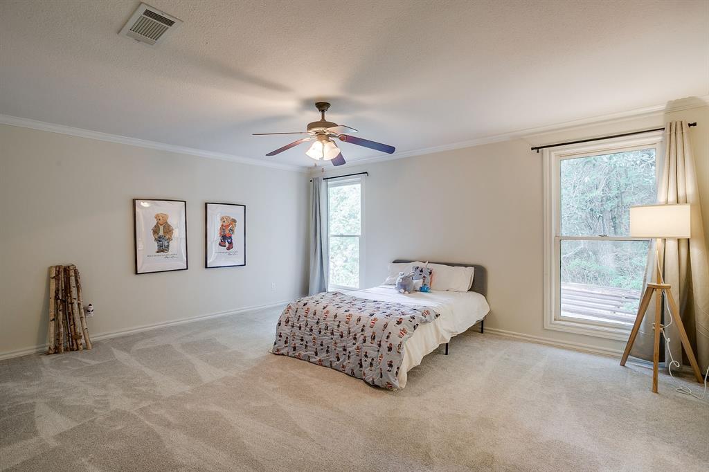 1805 Burton Hill Road Fort Worth, TX 76107 - Photo 27 of 39 a living room with a bed furniture and a window