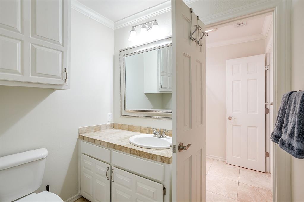 1805 Burton Hill Road Fort Worth, TX 76107 - Photo 28 of 39 a bathroom with a sink a toilet and shower