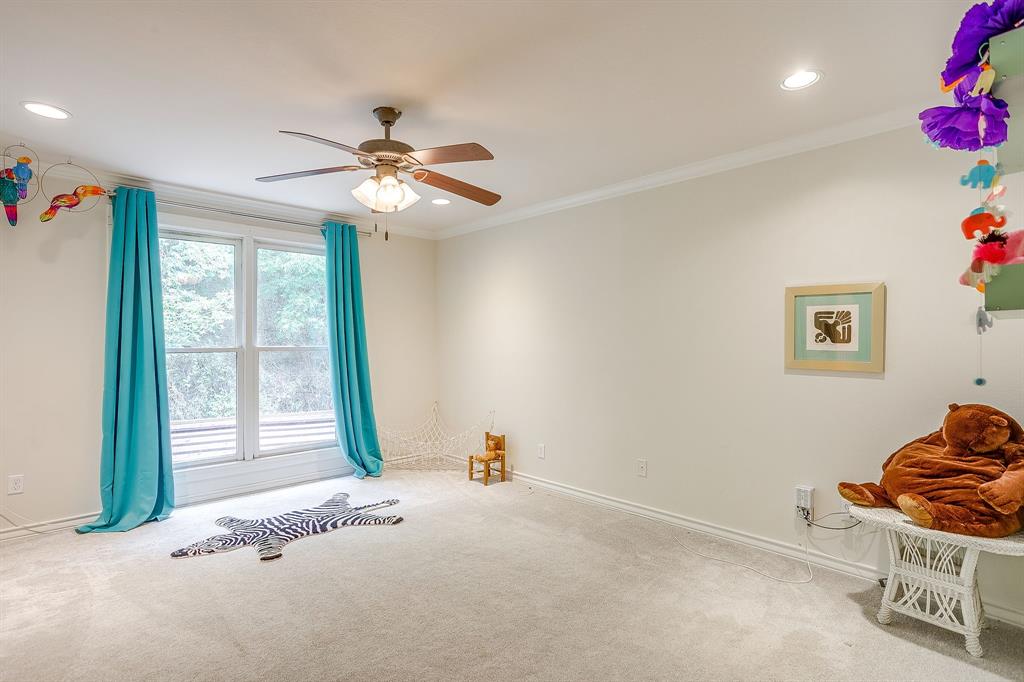 1805 Burton Hill Road Fort Worth, TX 76107 - Photo 32 of 39 a bedroom with furniture and window