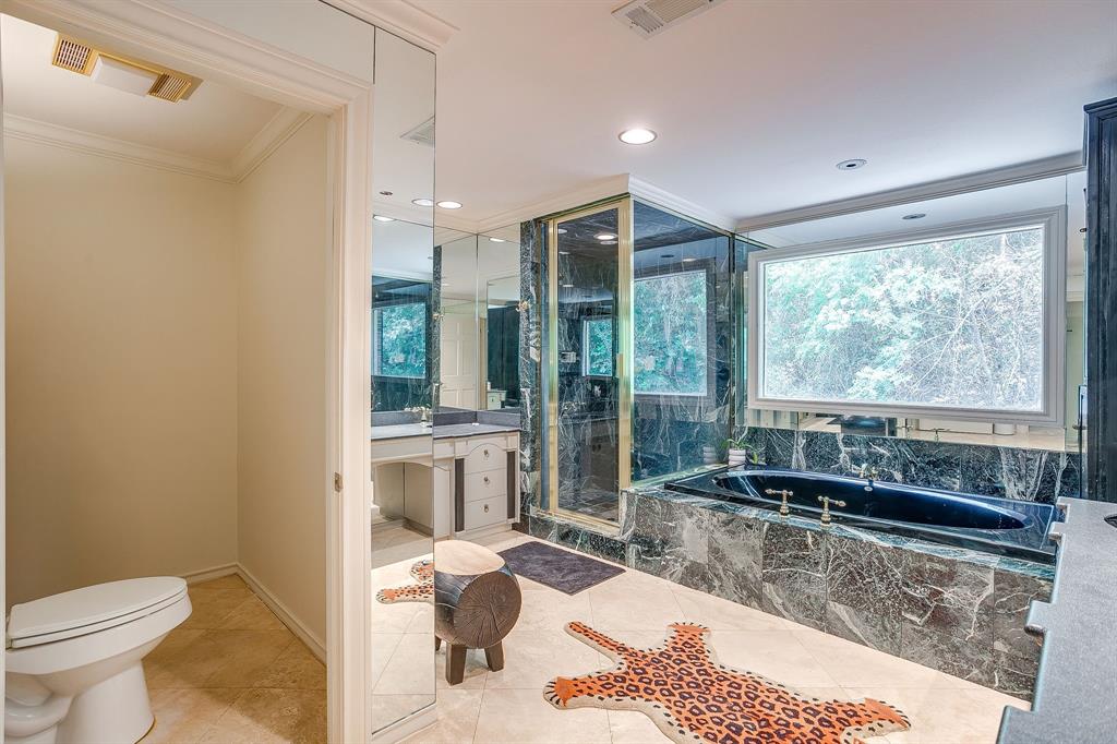 1805 Burton Hill Road Fort Worth, TX 76107 - Photo 36 of 39 a large bathroom with a large tub and shower
