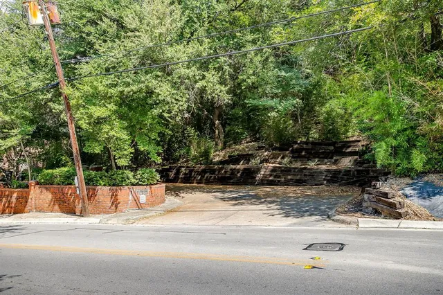 a view of a swimming pool with a bench