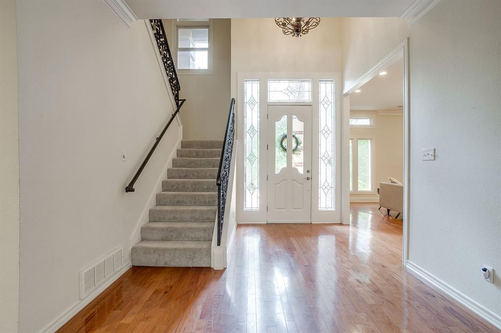 1805 Burton Hill Road Fort Worth, TX 76107 - Photo 6 of 39 a view of an entryway with wooden floor and door