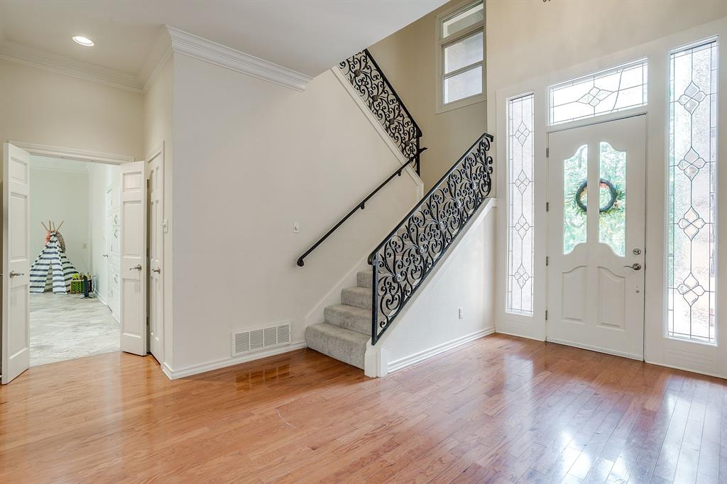 1805 Burton Hill Road Fort Worth, TX 76107 - Photo 7 of 39 a view of entryway and hall with wooden floor