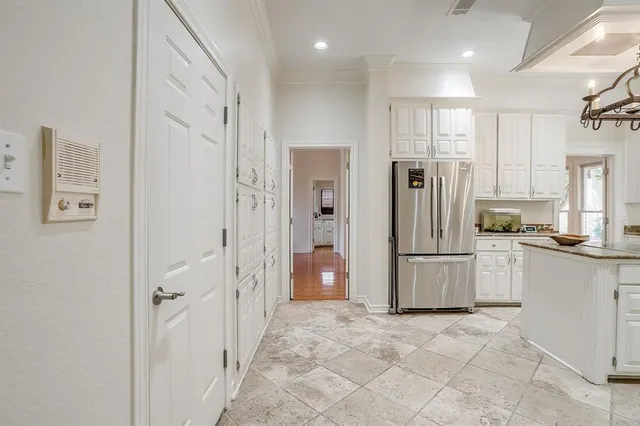 a bathroom with a refrigerator and a sink