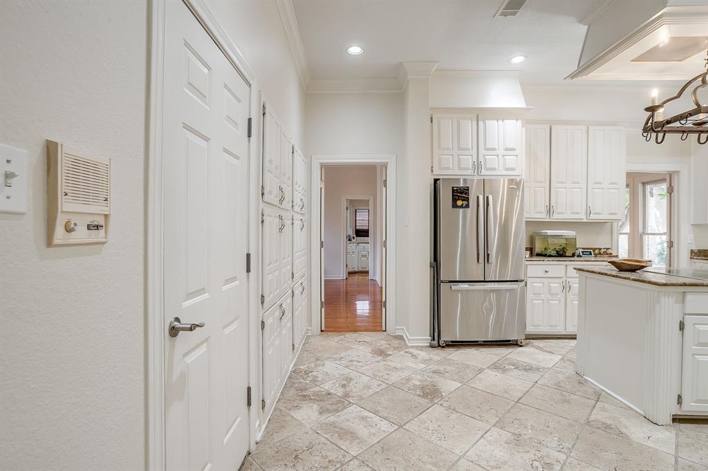 1805 Burton Hill Road Fort Worth, TX 76107 - Photo 9 of 39 a bathroom with a refrigerator and a sink