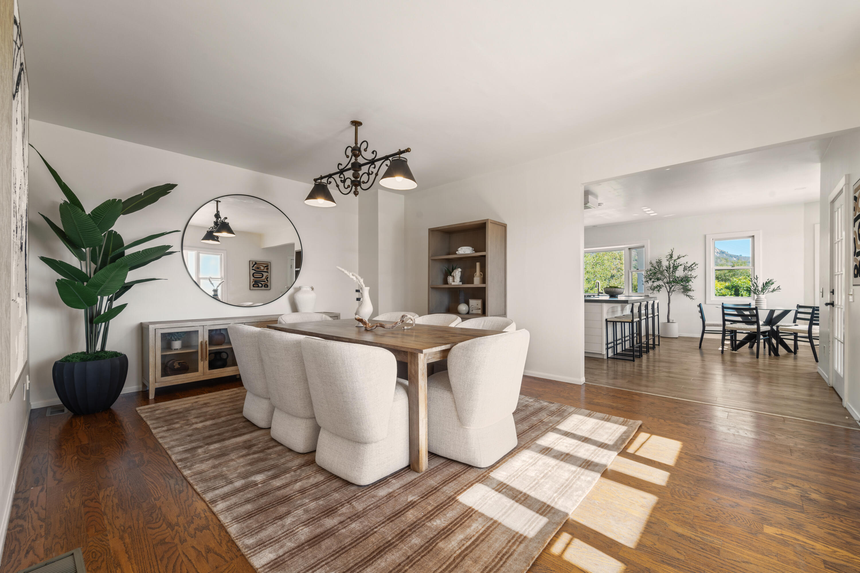 4508 Foothill Road Carpinteria, CA 93013 - Photo 12 of 31 a living room with furniture a mirror and wooden floor