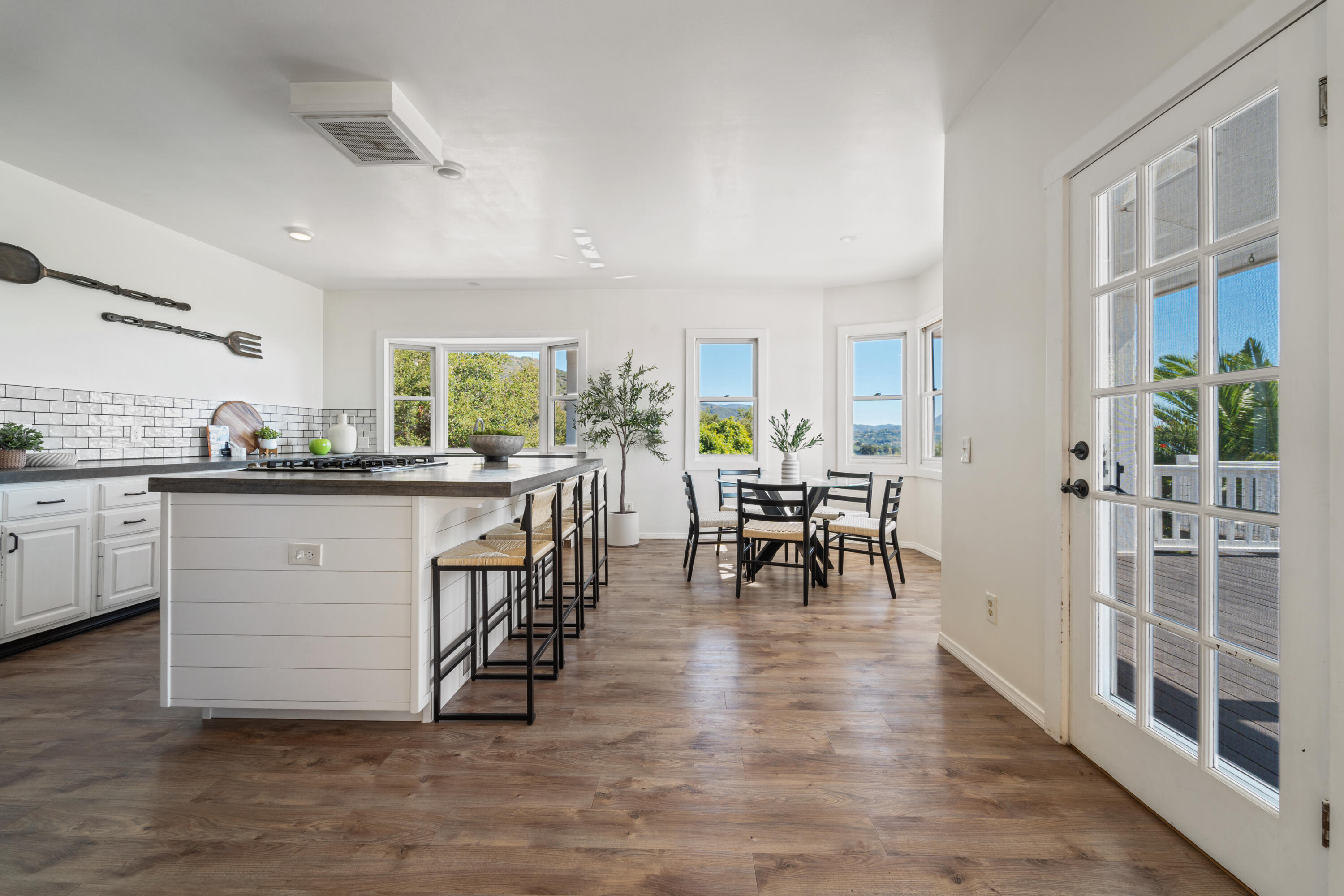 4508 Foothill Road Carpinteria, CA 93013 - Photo 14 of 31 a kitchen with a table chairs and a view of living room