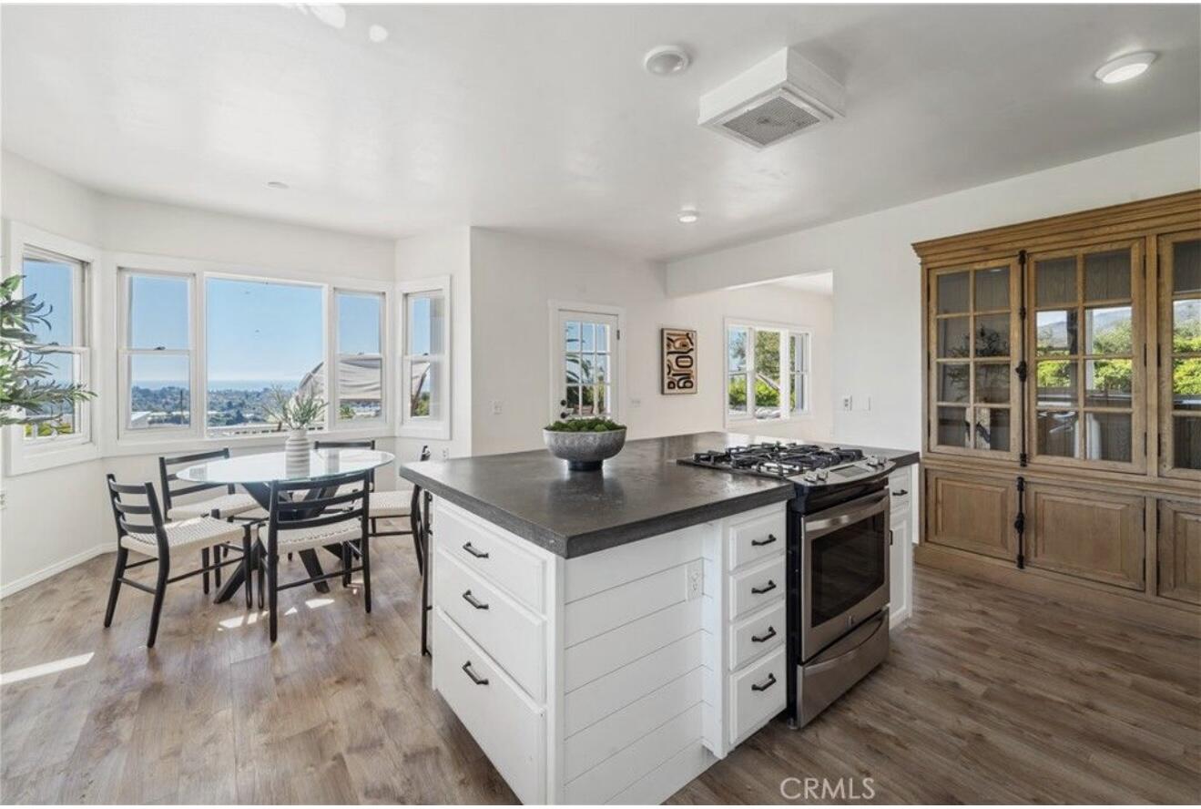 4508 Foothill Road Carpinteria, CA 93013 - Photo 15 of 31 a kitchen with stainless steel appliances granite countertop a stove and a sink