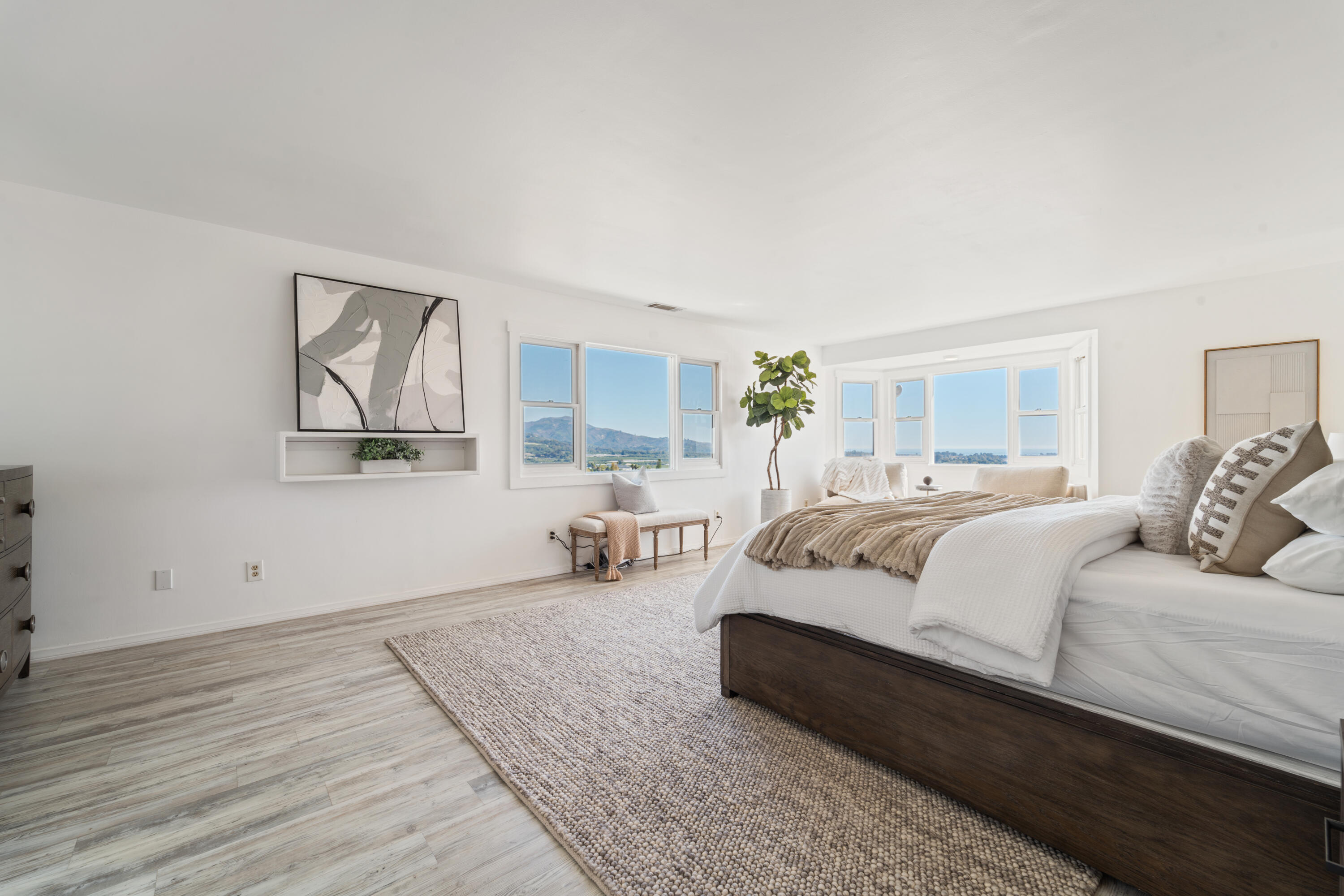 4508 Foothill Road Carpinteria, CA 93013 - Photo 16 of 31 a spacious bedroom with a bed and window
