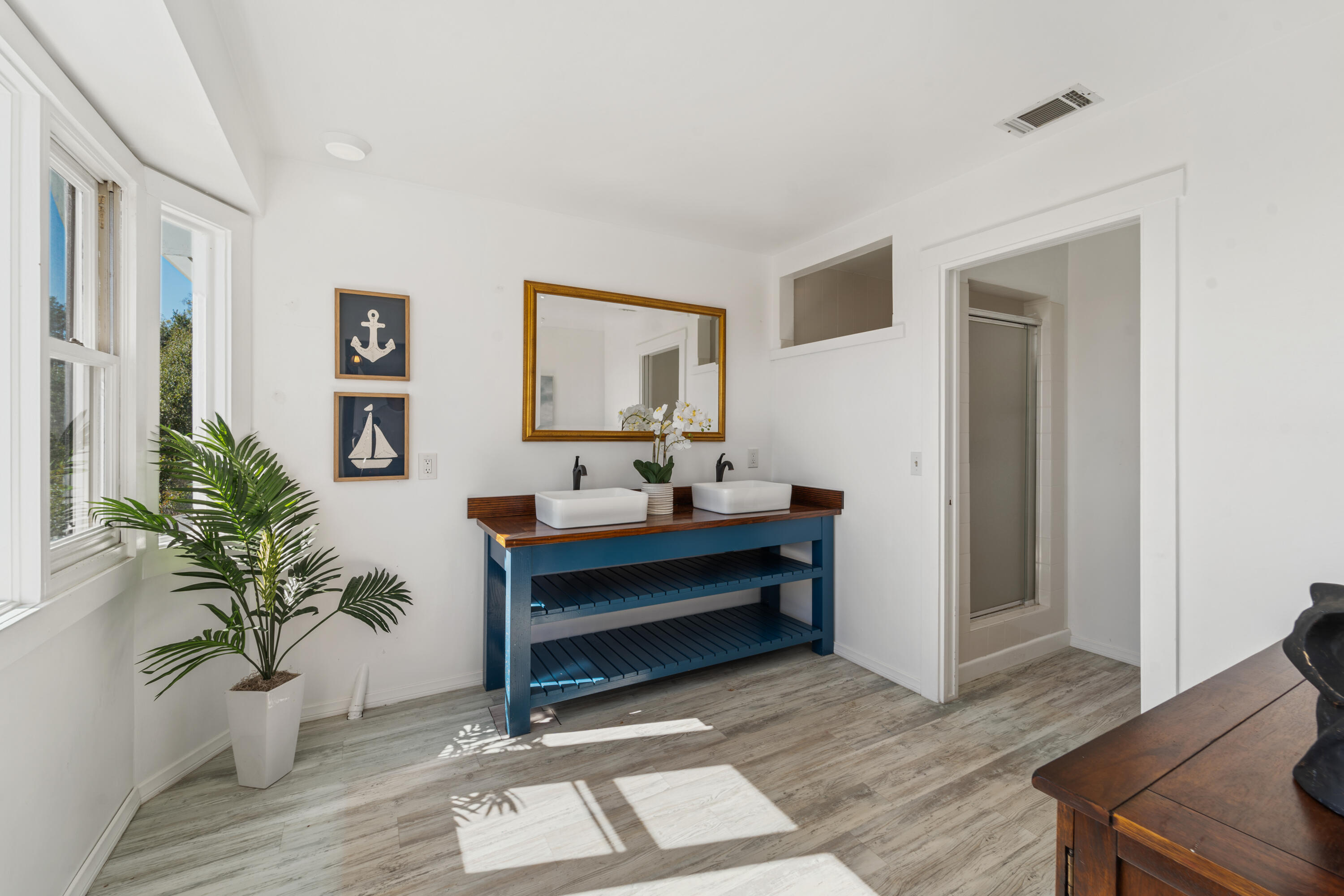 4508 Foothill Road Carpinteria, CA 93013 - Photo 19 of 31 a living room with furniture and a potted plant