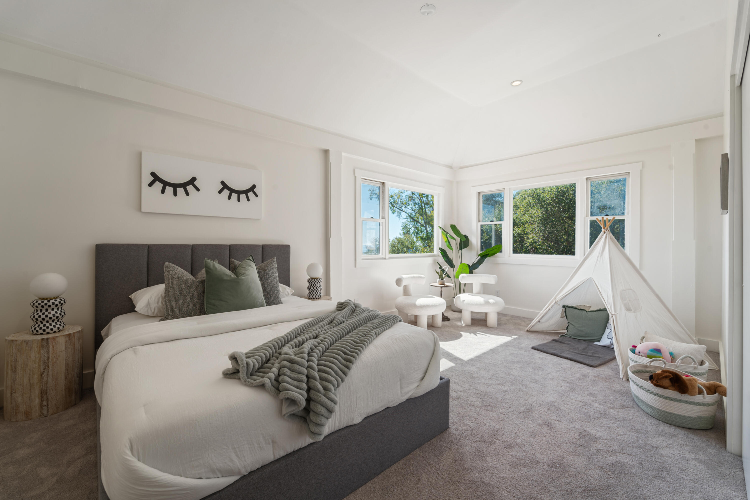 4508 Foothill Road Carpinteria, CA 93013 - Photo 23 of 31 a bed room with a bed and a couch