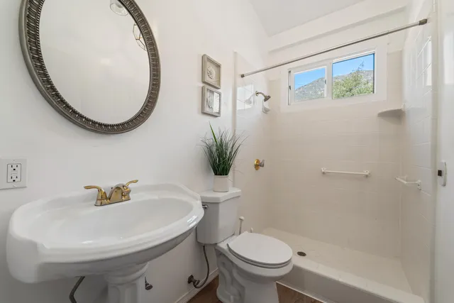 a view of swimming pool with outdoor seating and city view