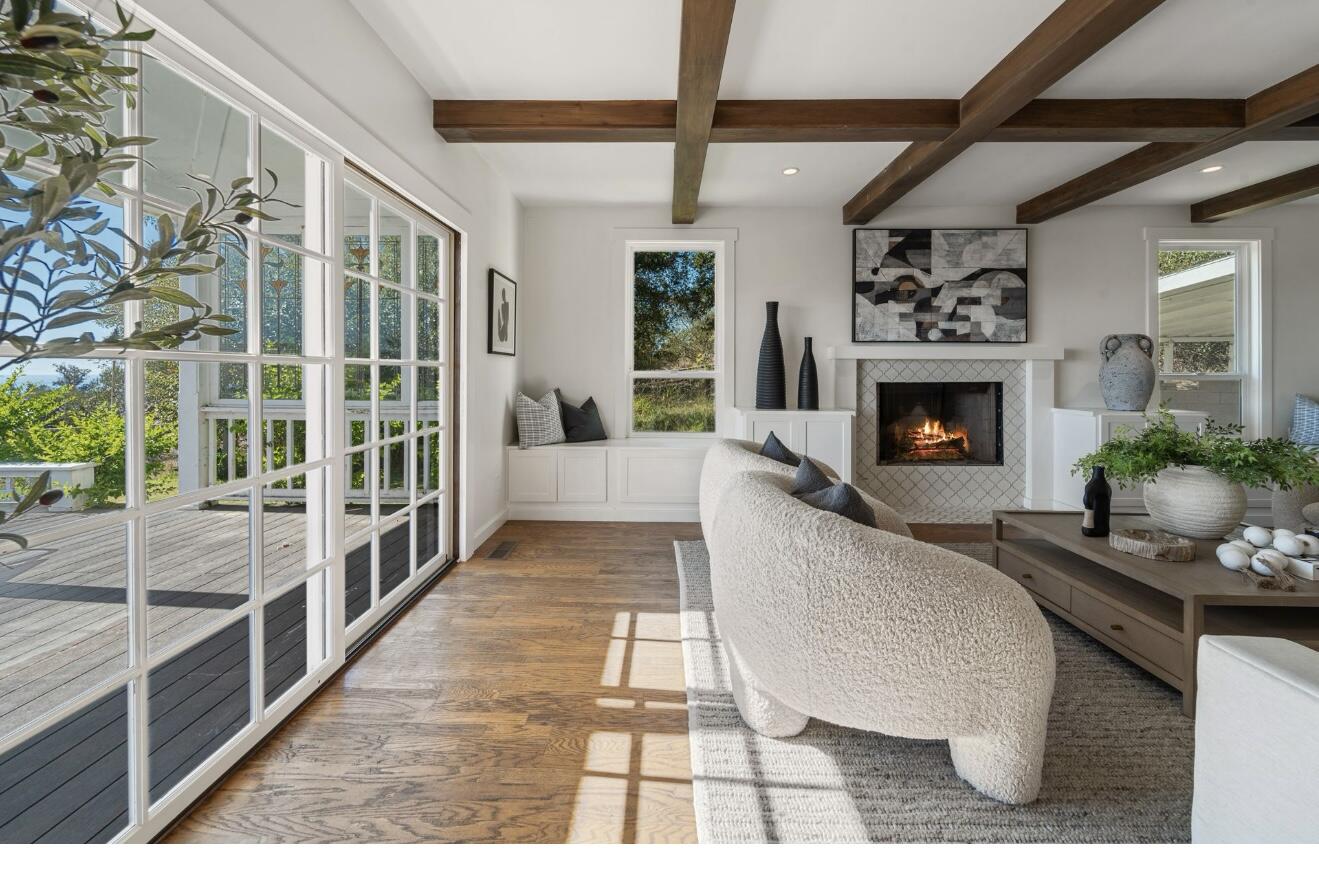 4508 Foothill Road Carpinteria, CA 93013 - Photo 8 of 31 a living room with furniture and a fireplace