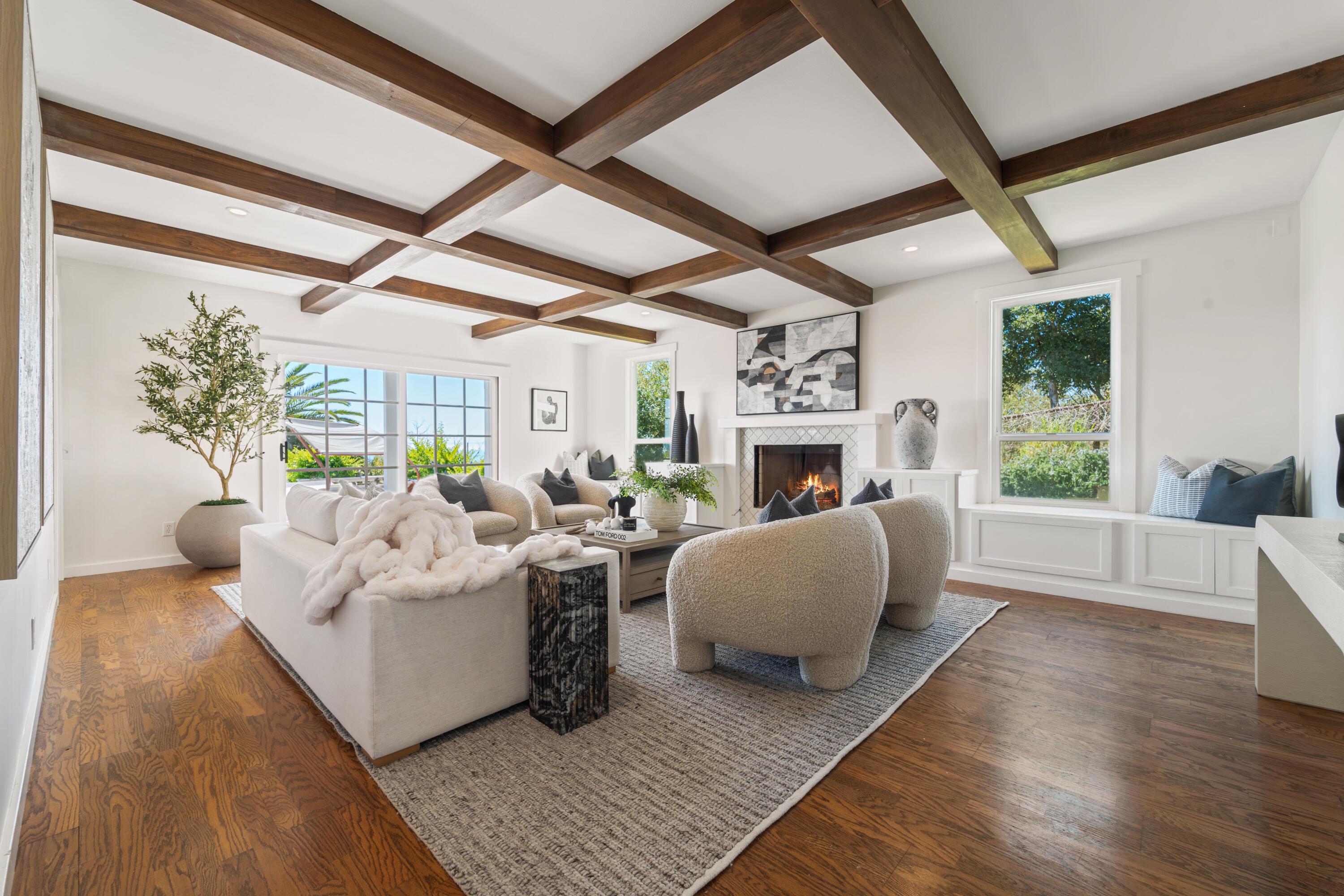 4508 Foothill Road Carpinteria, CA 93013 - Photo 9 of 31 a living room with fireplace furniture and a large window