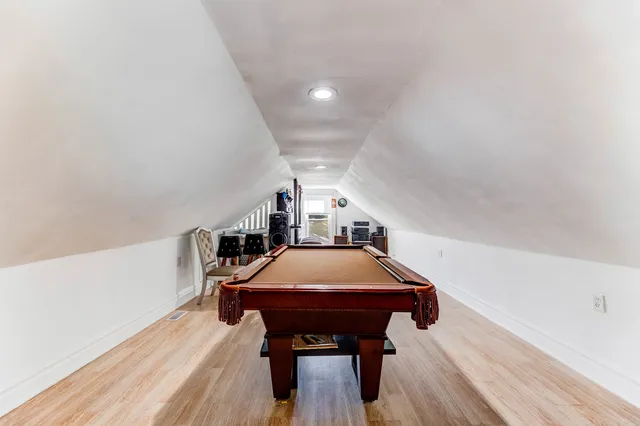 a room with furniture and wooden floor