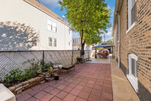 a view of a pathway along with potted plants
