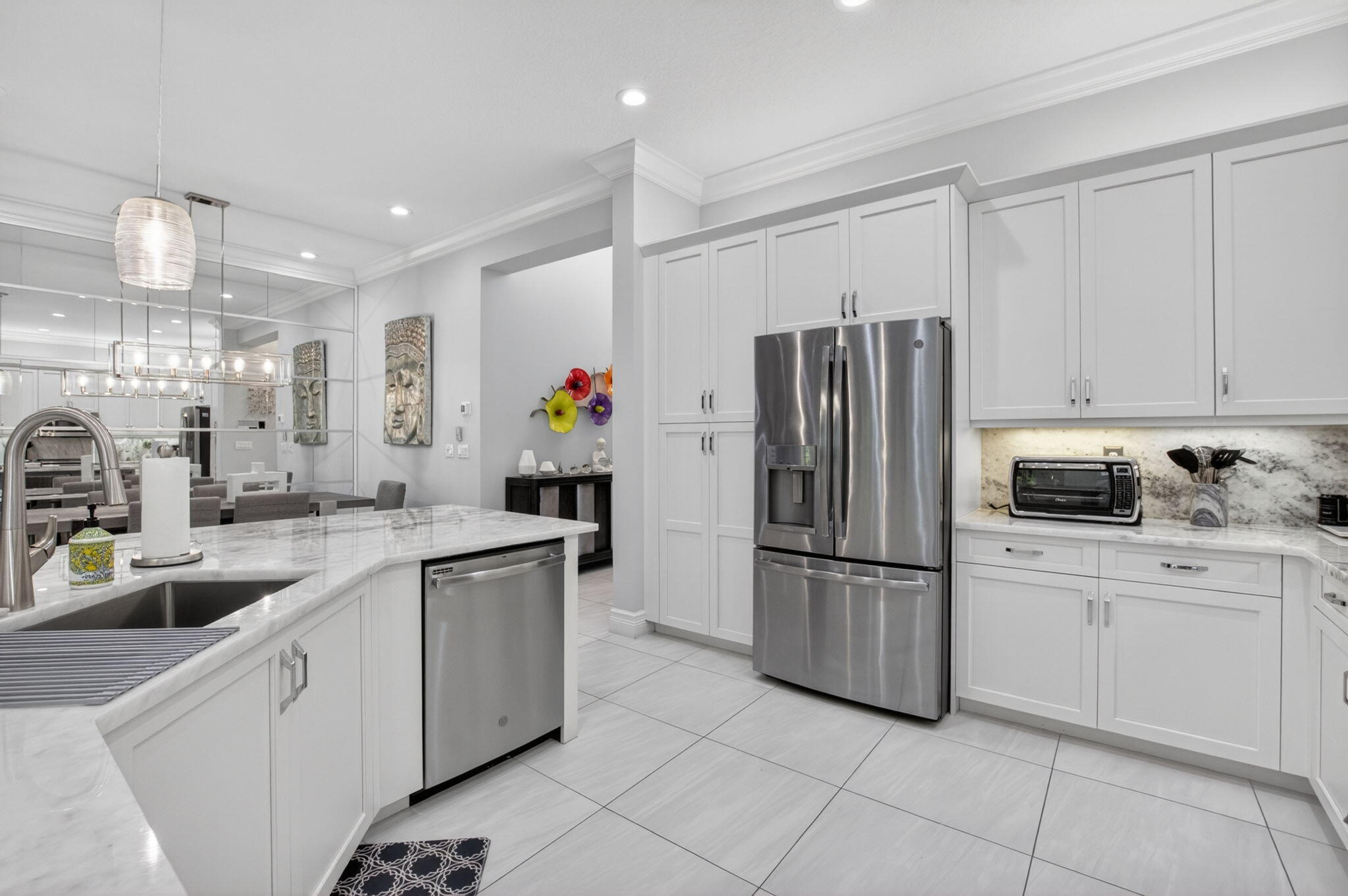 8263 Arabian Range Road Boynton Beach, FL 33473 - Photo 20 of 52 a kitchen with appliances a sink and cabinets