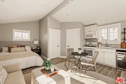 a bedroom with a bed and a chair