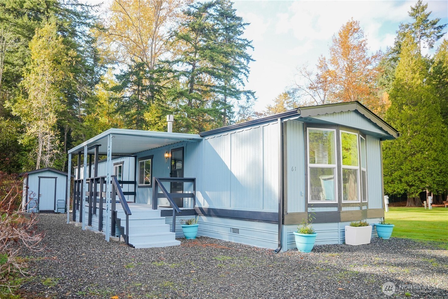 4672 Birch Bay Lynden Road, Unit 61 Birch Bay, WA 98230 - Photo 2 of 11 a view of a house with a yard and roof