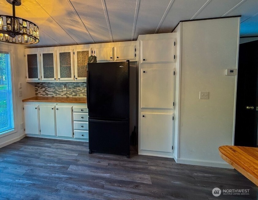4672 Birch Bay Lynden Road, Unit 61 Birch Bay, WA 98230 - Photo 5 of 11 a kitchen with stainless steel appliances granite countertop a refrigerator and a sink