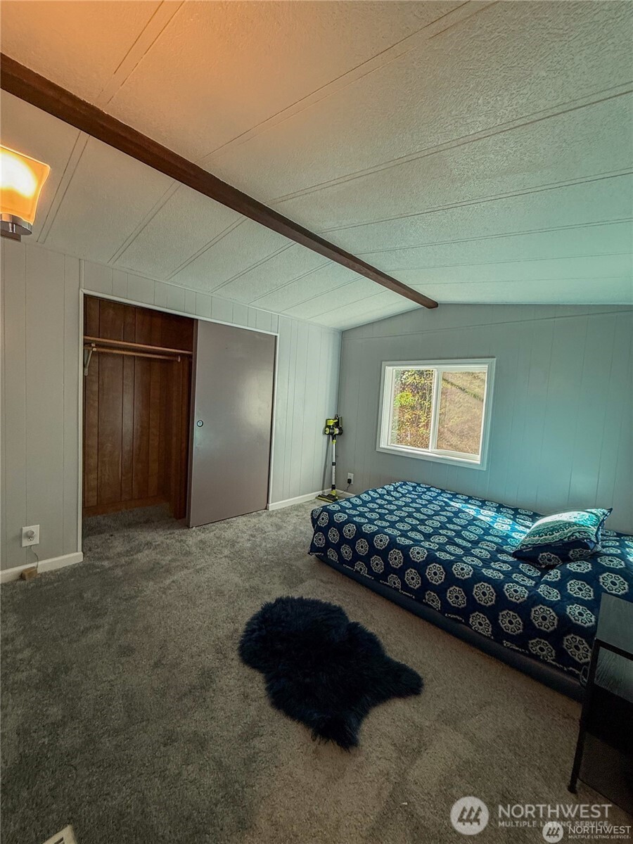 4672 Birch Bay Lynden Road, Unit 61 Birch Bay, WA 98230 - Photo 9 of 11 a bedroom with bed and a window