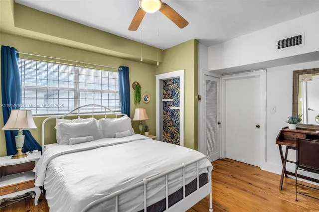 a bedroom with a bed and window