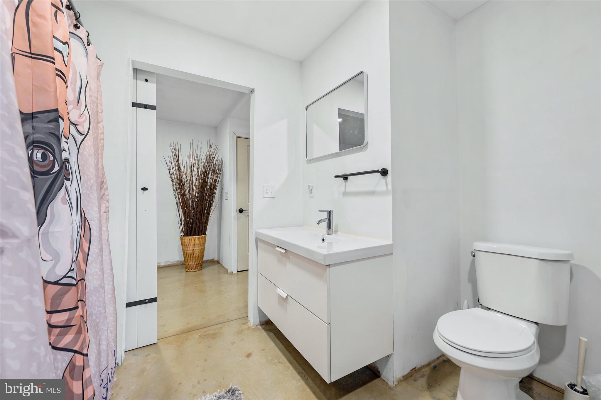 238 Buttonwood Road Landenberg, PA 19350 - Photo 22 of 50 a bathroom with a toilet sink and mirror