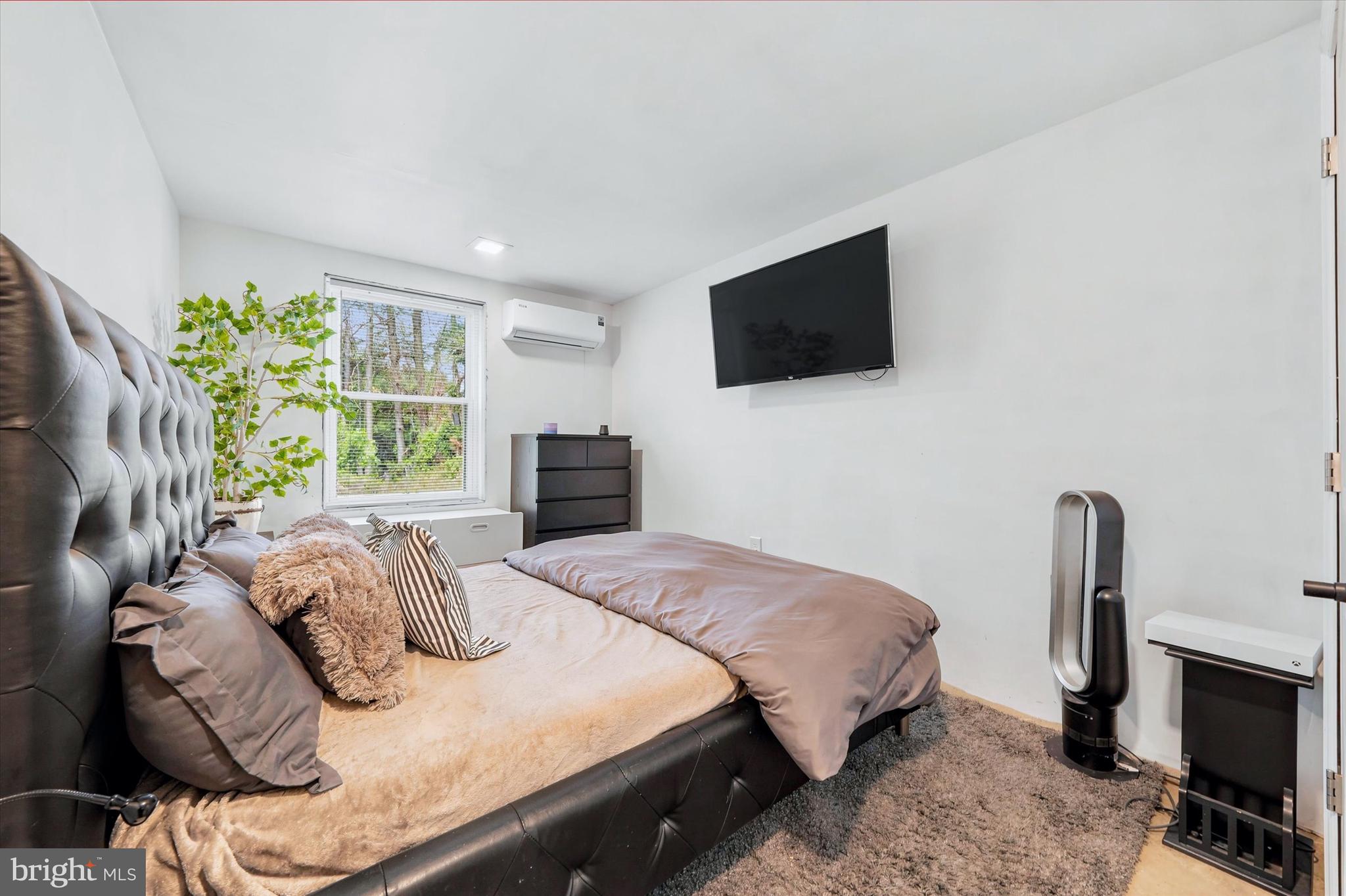 238 Buttonwood Road Landenberg, PA 19350 - Photo 24 of 50 a bedroom with a bed a flat screen tv and a window