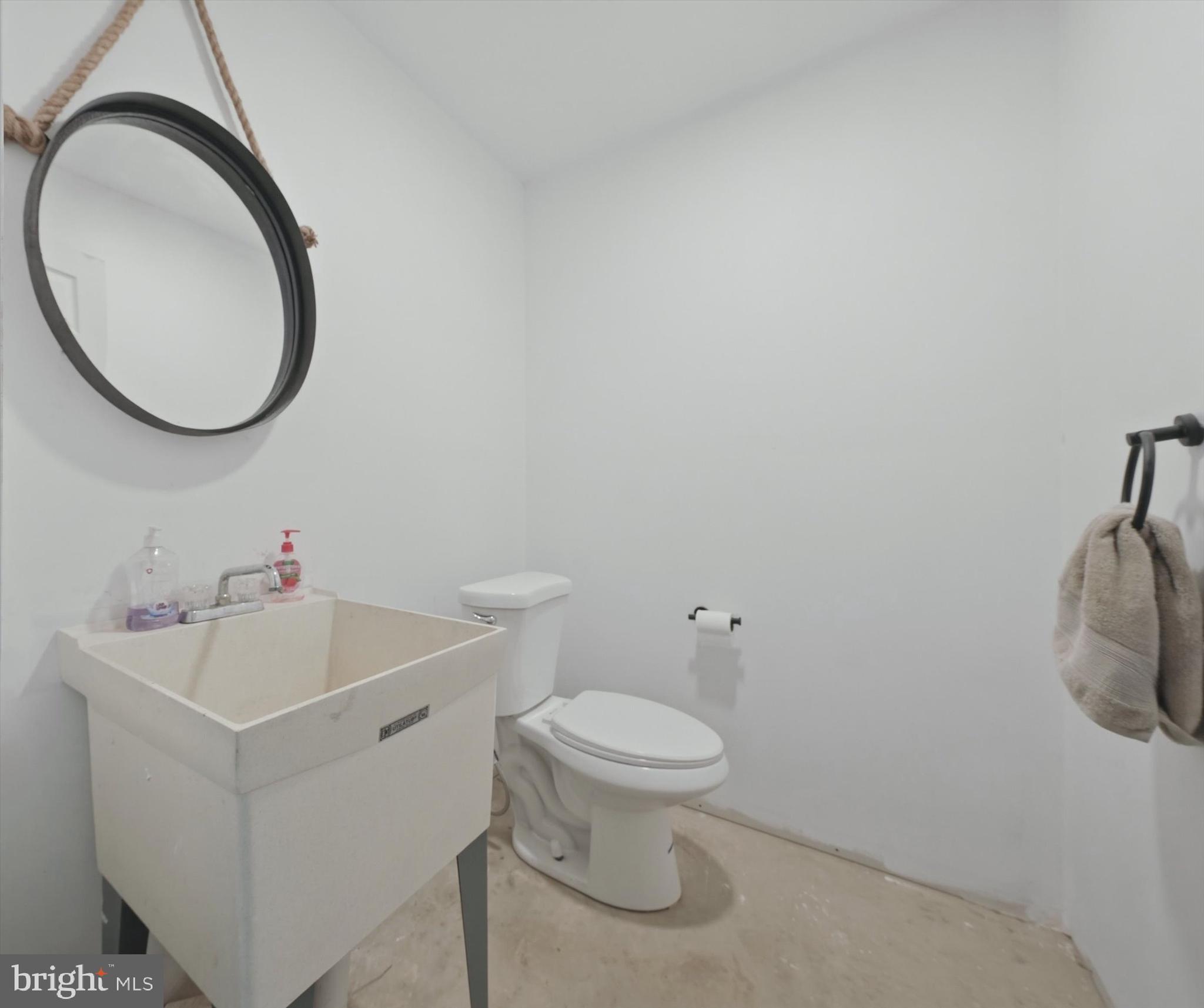 238 Buttonwood Road Landenberg, PA 19350 - Photo 43 of 50 a white toilet sitting next to a bathroom sink