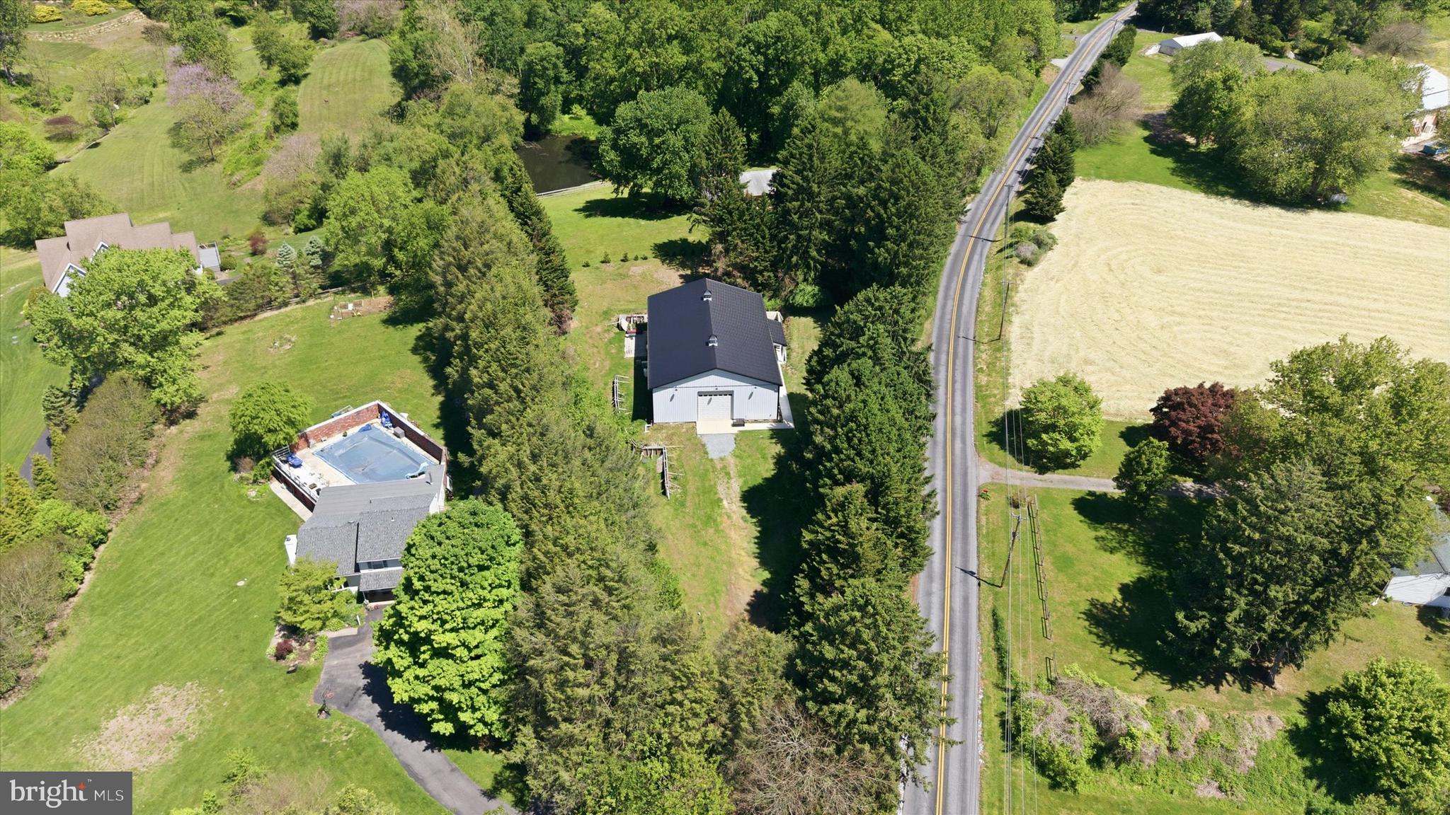238 Buttonwood Road Landenberg, PA 19350 - Photo 46 of 50 an aerial view of a house with a yard and lake view