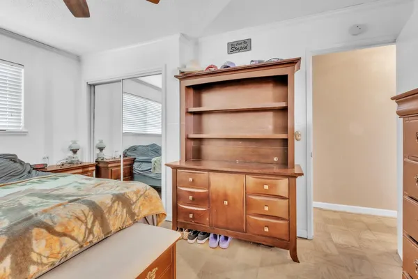 a bedroom with a bed and a dresser