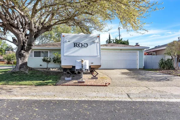 a kitchen with stainless steel appliances kitchen island granite countertop a refrigerator and a stove