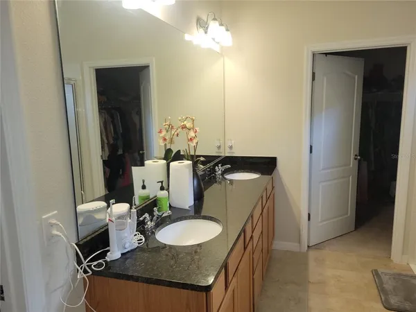 a bathroom with a shower and a glass door