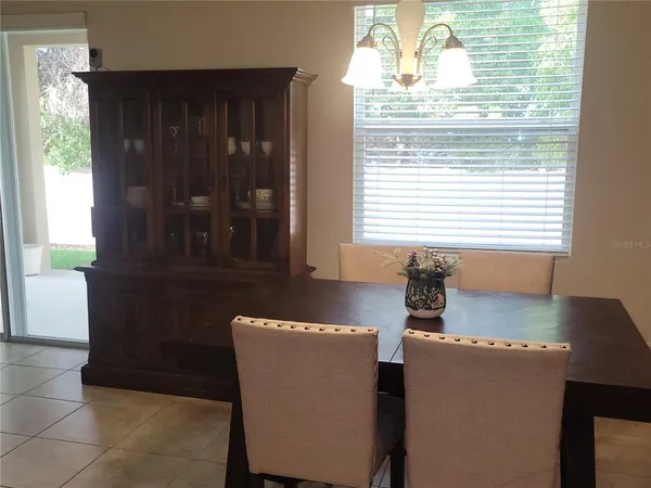 a kitchen with stainless steel appliances granite countertop a refrigerator a stove a microwave and a sink