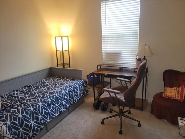 a bathroom with a sink a toilet a mirror and vanity