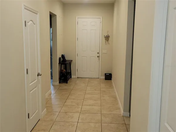 a view of a closet area with living room