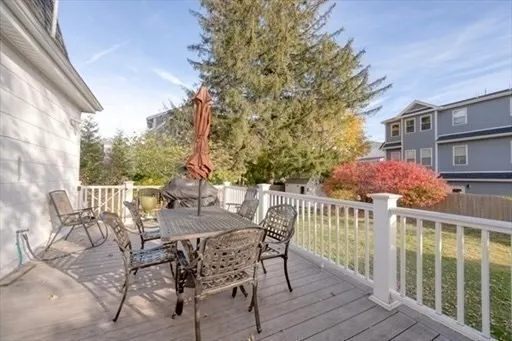 a view of a chair and table on the deck