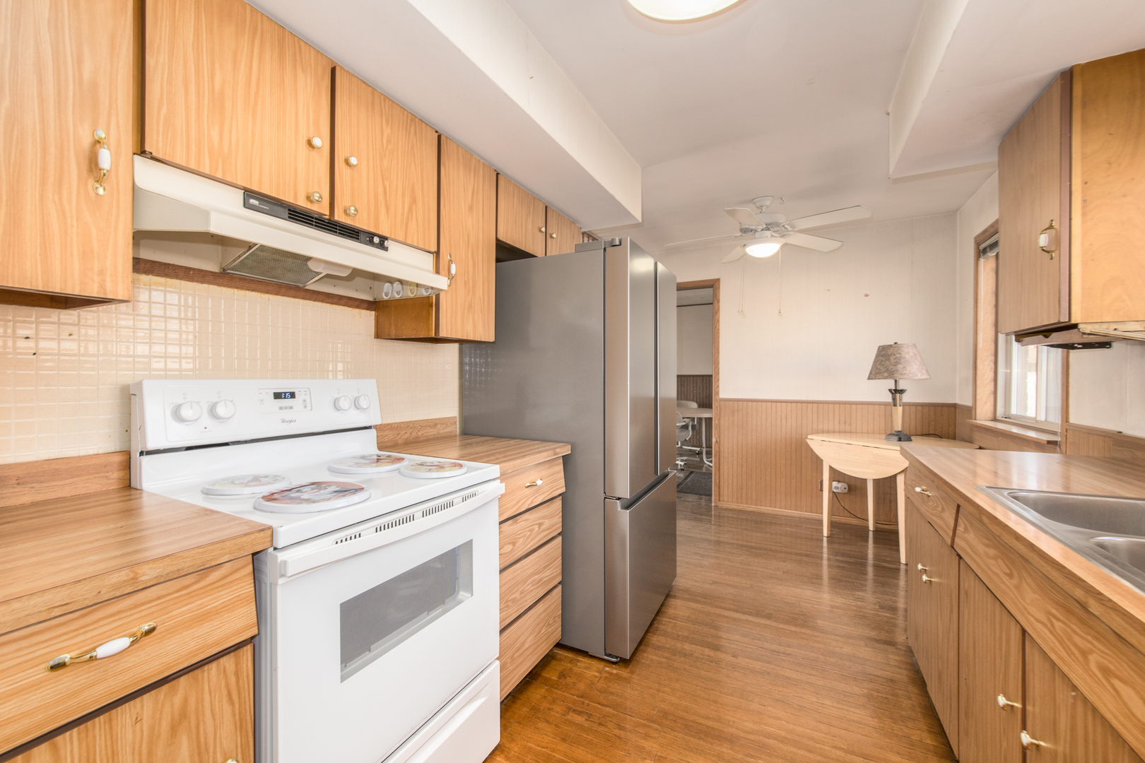 170 Westmere Road Des Plaines, IL 60016 - Photo 6 of 21 a kitchen with appliances a sink and cabinets
