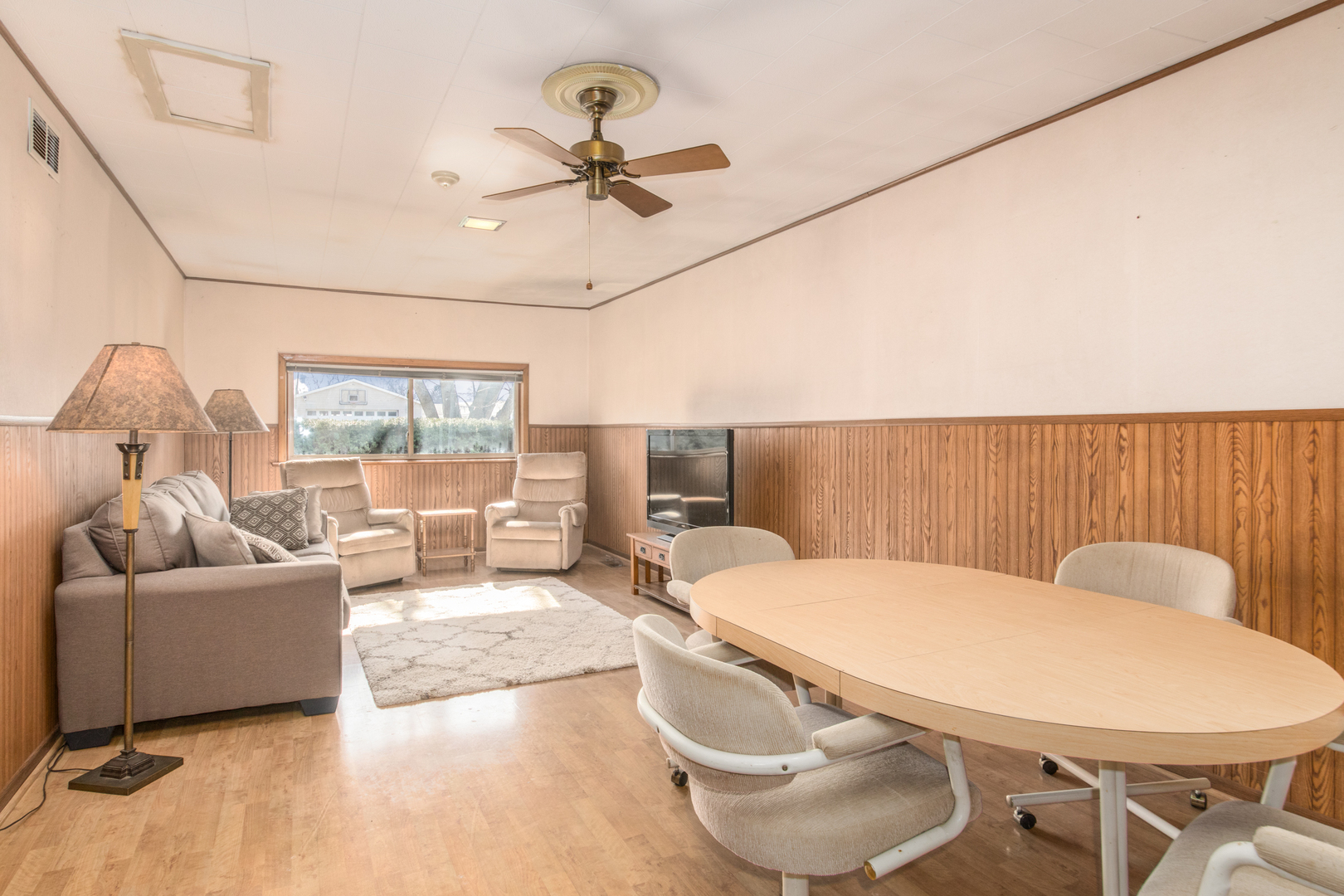 170 Westmere Road Des Plaines, IL 60016 - Photo 9 of 21 a living room with furniture and a large window