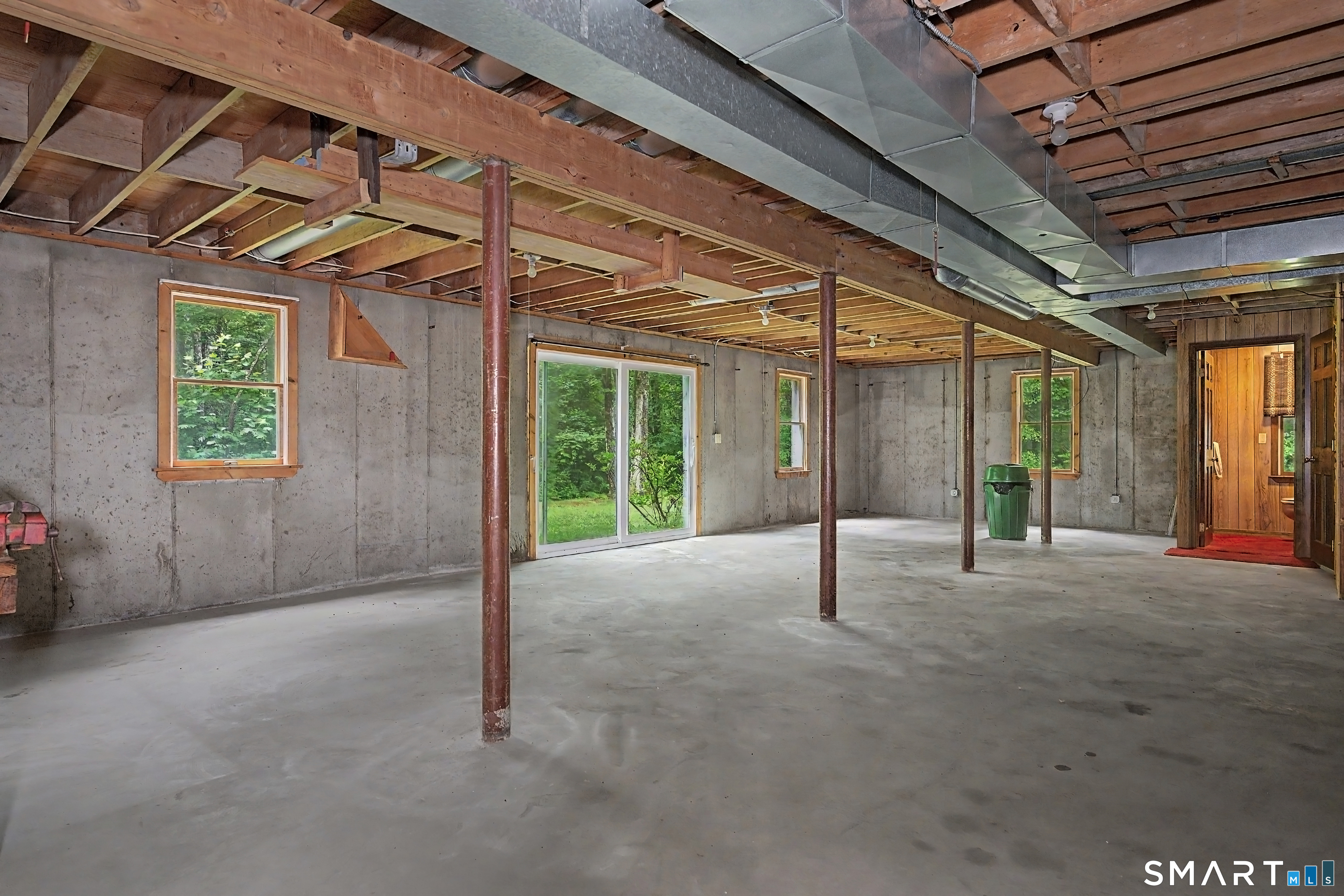 370 Hubbard Road Haddam, CT 06441 - Photo 33 of 39 Unfinished basement space with high ceilings and newer Pella sliders.