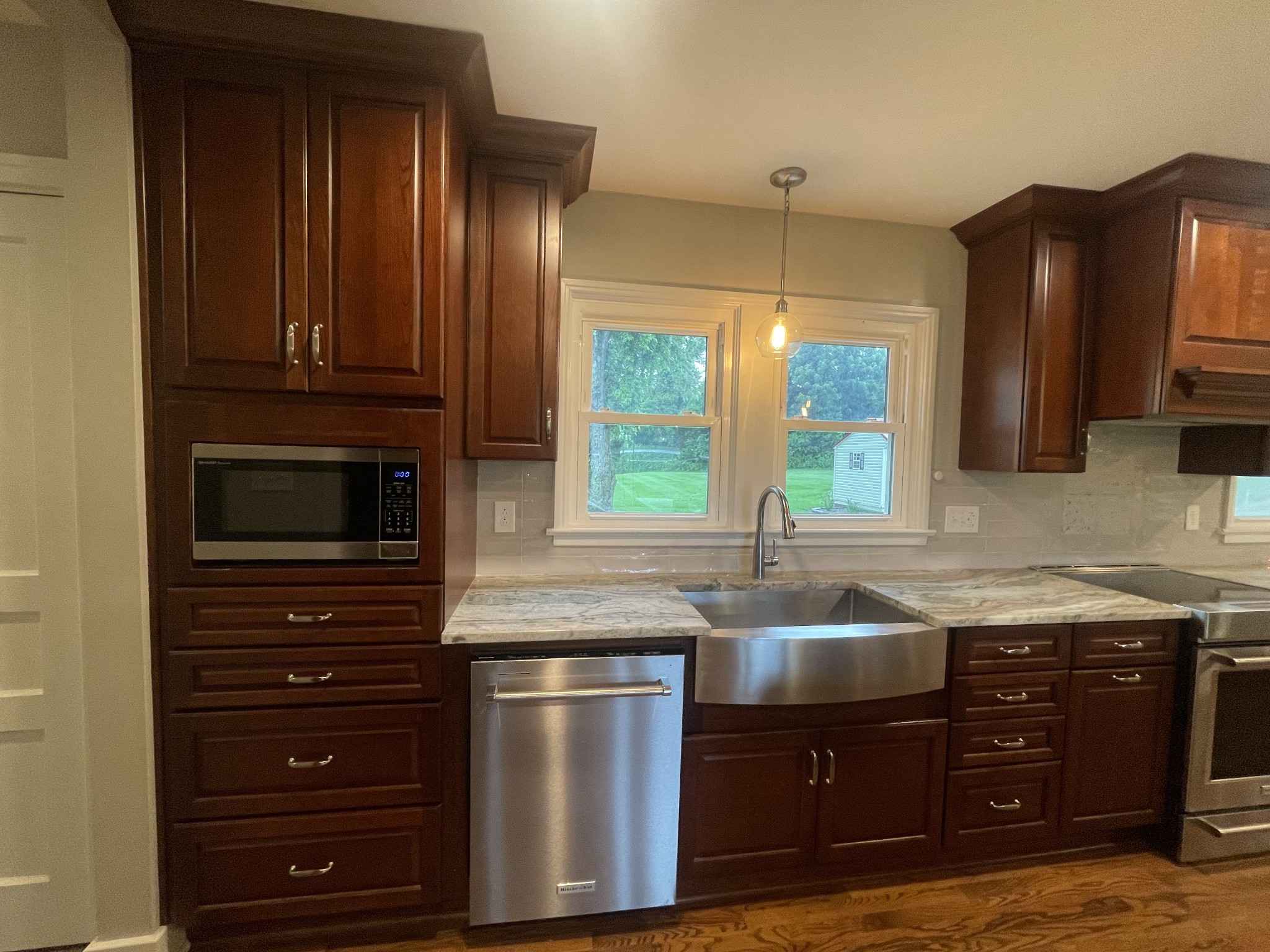4467 Highway 431 Springfield, TN 37172 - Photo 26 of 47 a kitchen with granite countertop wooden cabinets and a stove top oven