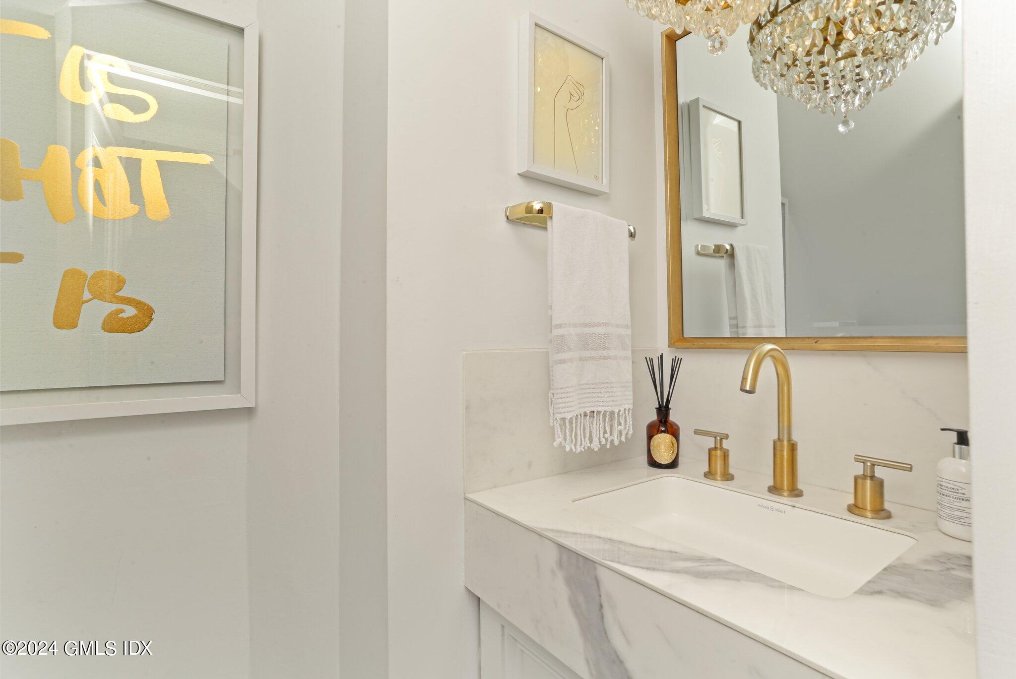 127 Dingletown Road Greenwich, CT 06830 - Photo 12 of 54 a bathroom with a sink and a mirror