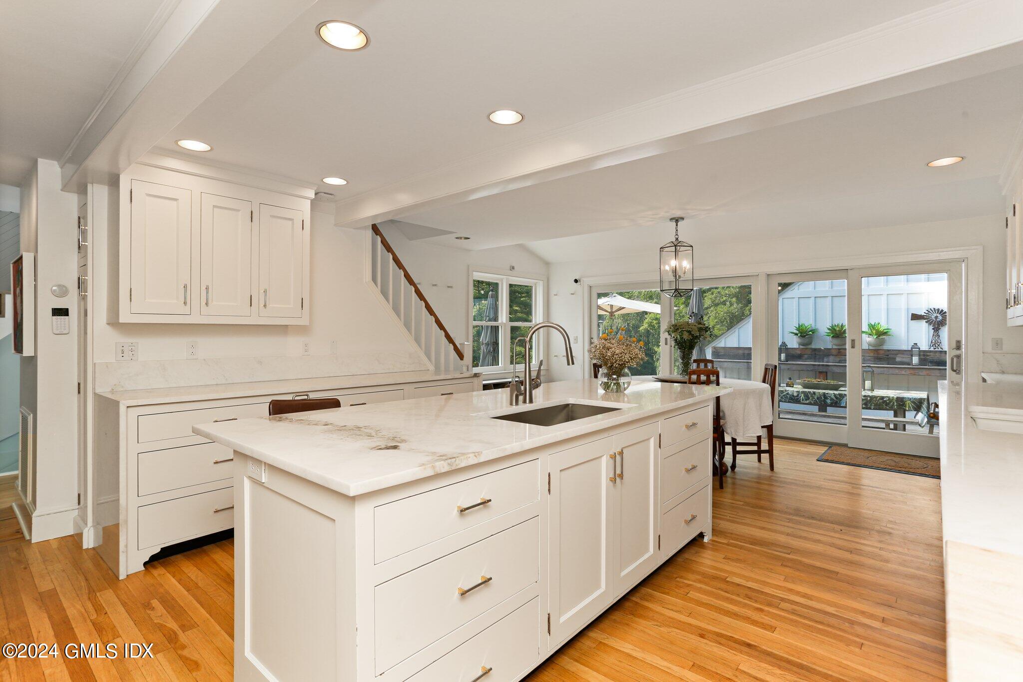 127 Dingletown Road Greenwich, CT 06830 - Photo 14 of 54 a kitchen with a sink stove and cabinets