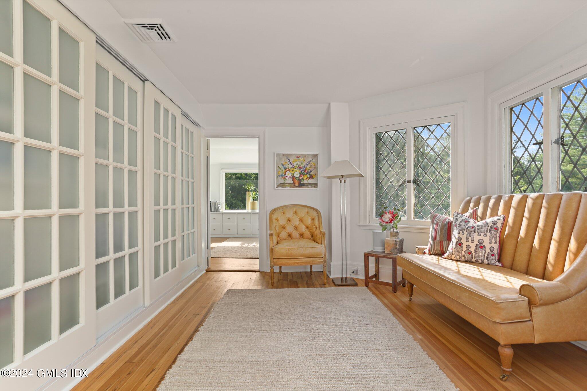 127 Dingletown Road Greenwich, CT 06830 - Photo 20 of 54 a living room with furniture and a table