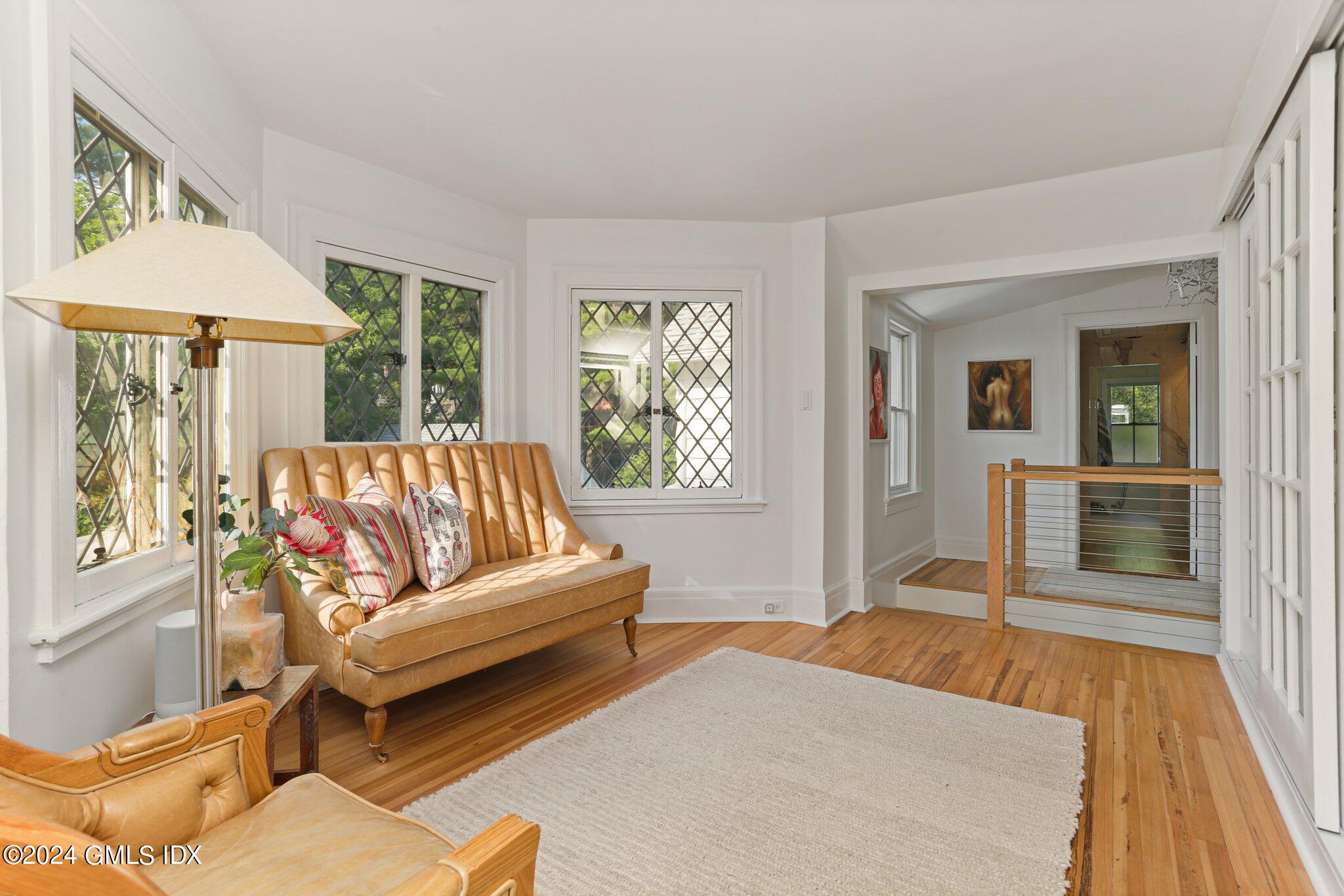 127 Dingletown Road Greenwich, CT 06830 - Photo 21 of 54 a living room with furniture and a fireplace