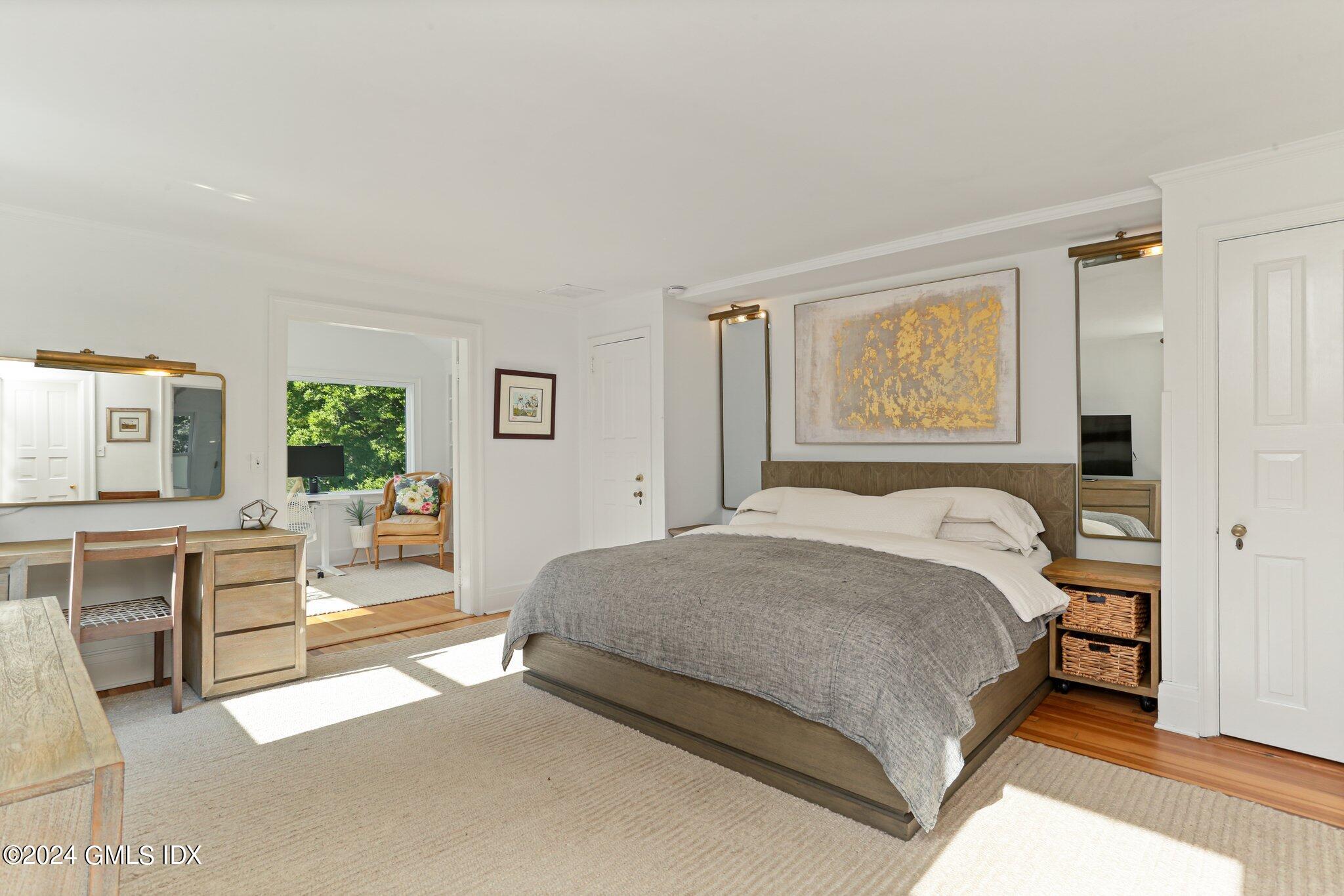 127 Dingletown Road Greenwich, CT 06830 - Photo 24 of 54 a spacious bedroom with a bed and a couch